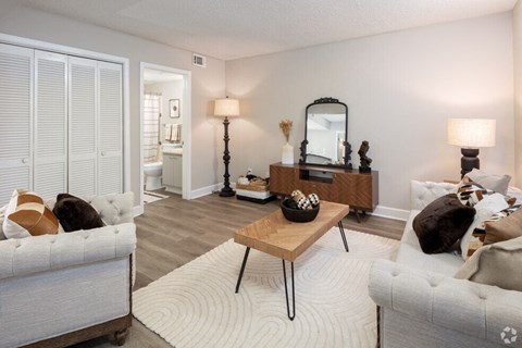 a living room with couches and a table