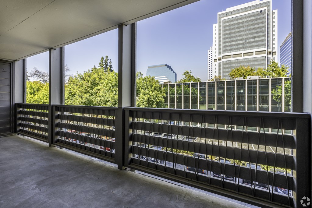 the view of the city from the balcony of a building