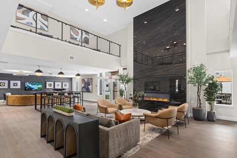 A modern living room with a fireplace and a TV.