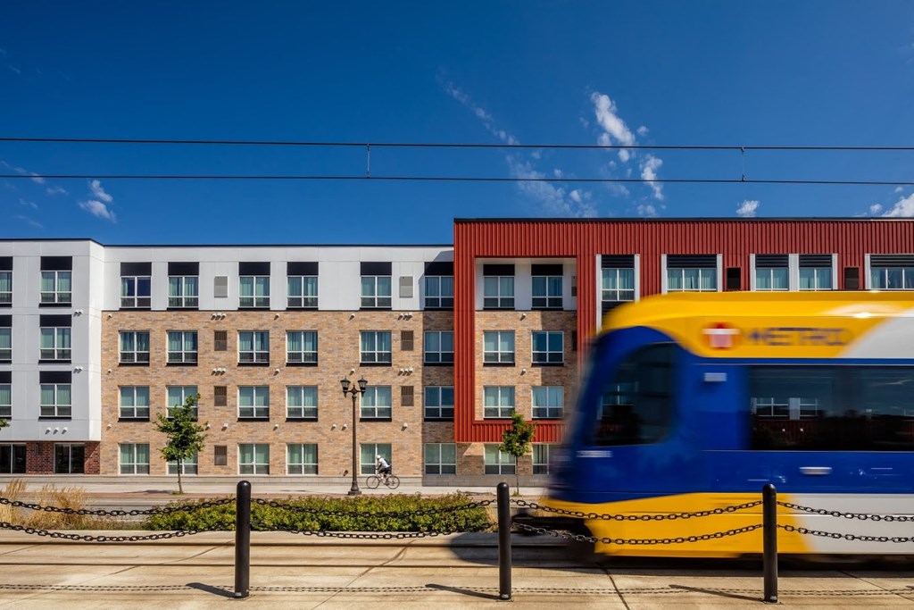 a train passes in front of a building
