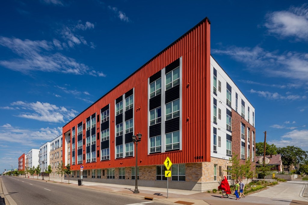 a large red building on the corner of a street