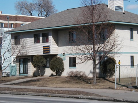 a white house with a sign on the side of it