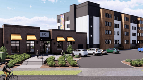 A modern building with a bicycle parked in front.