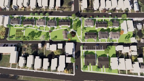 A bird's eye view of a residential area with houses and green spaces.