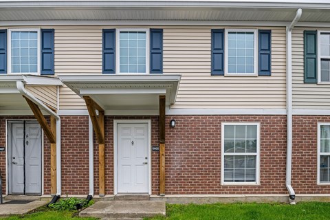 A house with a white door and windows.