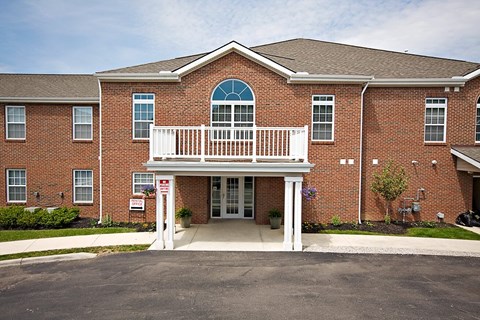 A red brick building with a white entrance.