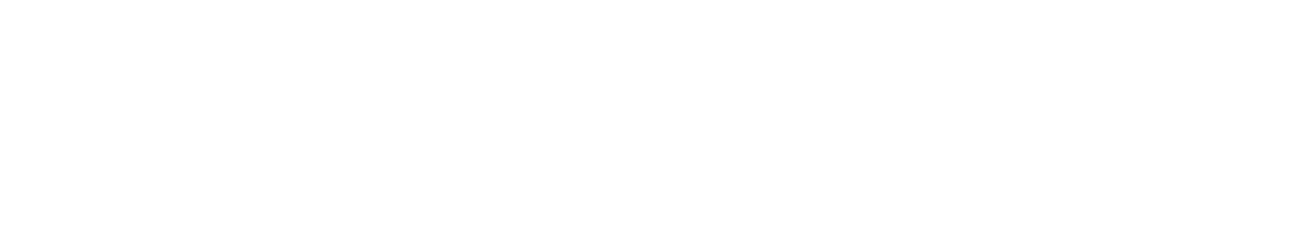 A black and white image of a sign for Vandalia Village Apartments.