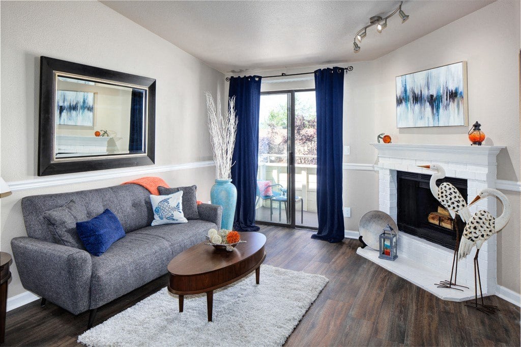 a living room with a fireplace and a couch