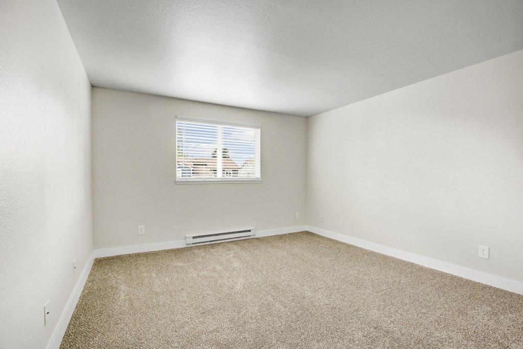 an empty room with white walls and a window at 2000 Lake Washington Apartments, Renton, 98056