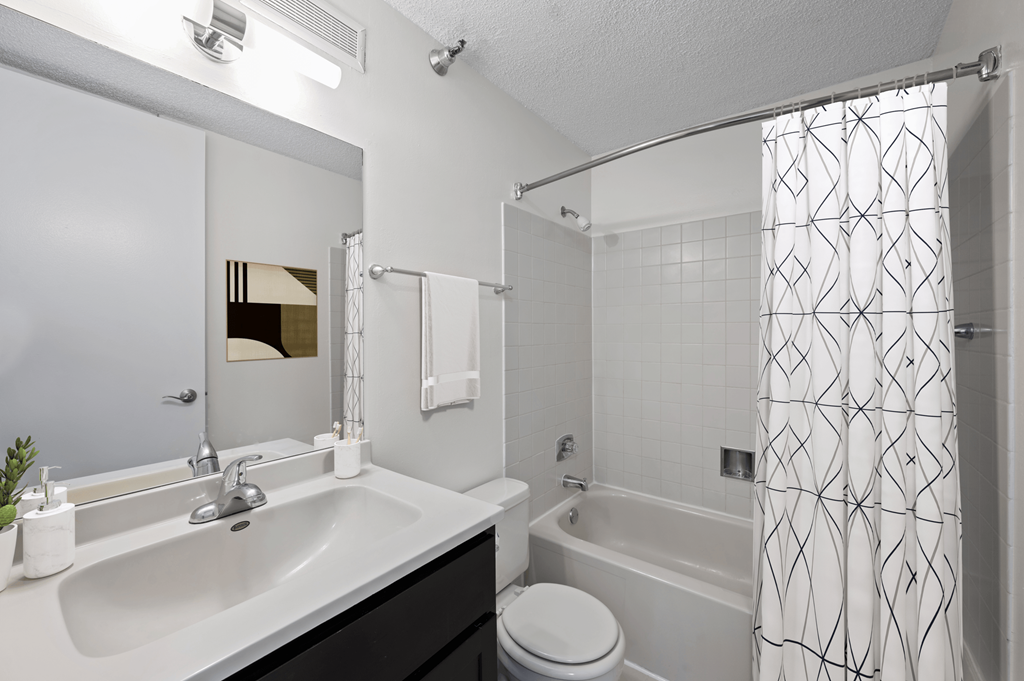 a bathroom with a sink and a shower and a toilet at Presidential Towers, Chicago, IL