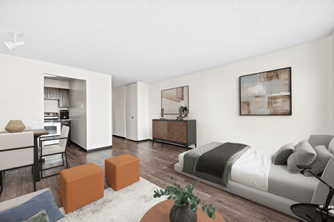 a bedroom with a bed and a living room with a kitchen at Presidential Towers, Illinois, 60661
