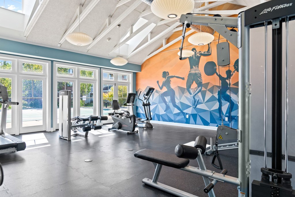 Fitness center flooded with natural light at Rosemont Square Apartments, Randolph, Massachusetts