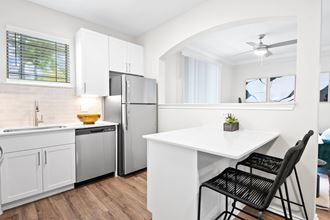 a kitchen with a white counter top and a stainless steel refrigerator at Mission Gate, Plano, TX, 75024