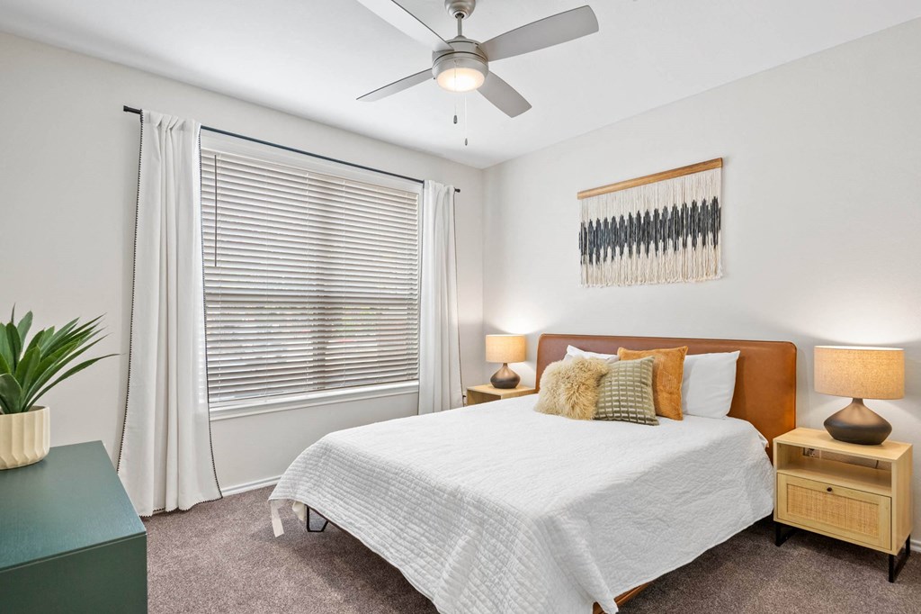 a bedroom with a bed and a ceiling fan at Mission Gate, Plano, 75024