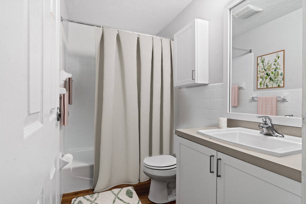 Brightly lit bathroom at Rosemont Square Apartments, Massachusetts, 02368