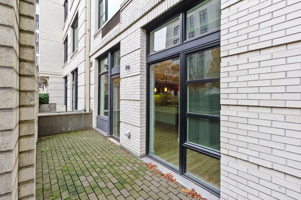 the front door of the house is open to the patio at The Parker Apartments, Portland, Oregon