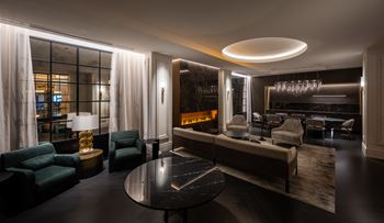 a living room filled with furniture and a table  at The Belden Stratford, Illinois, 60614
