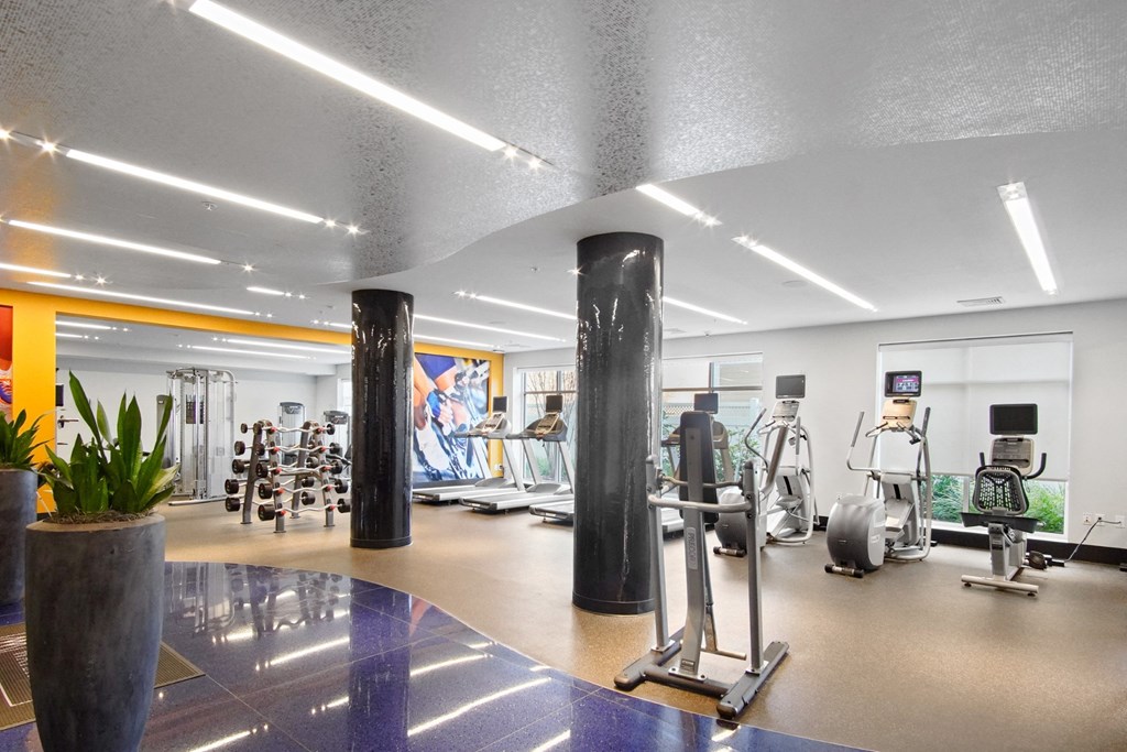 a gym with weights and cardio equipment  at Glen Mills in Glen Mills, PA