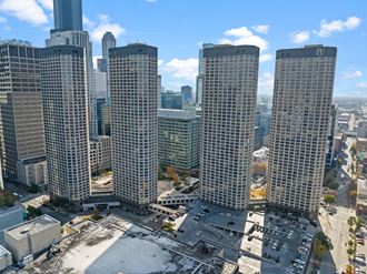 an aerial view of a city skyline with tall skyscrapers at Presidential Towers, Illinois, 60661