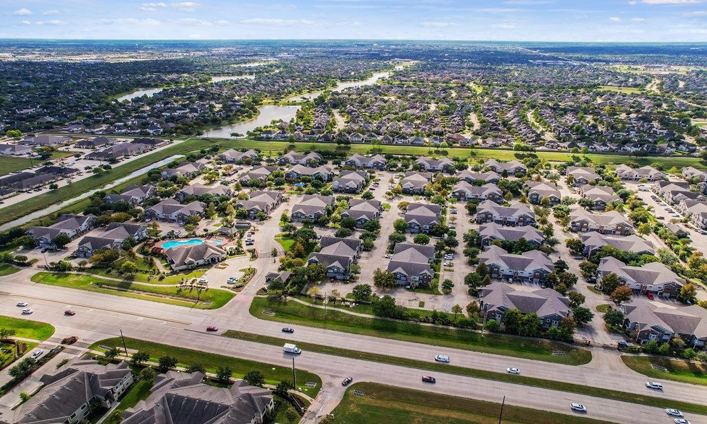 an aerial view of a neighborhood of houses and roads at Sladestone Shadow Creek, Pearland, TX