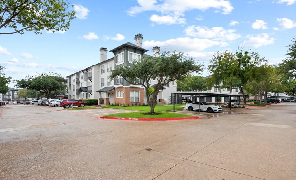 an empty parking lot in front of an apartment building at Mission Gate, Texas