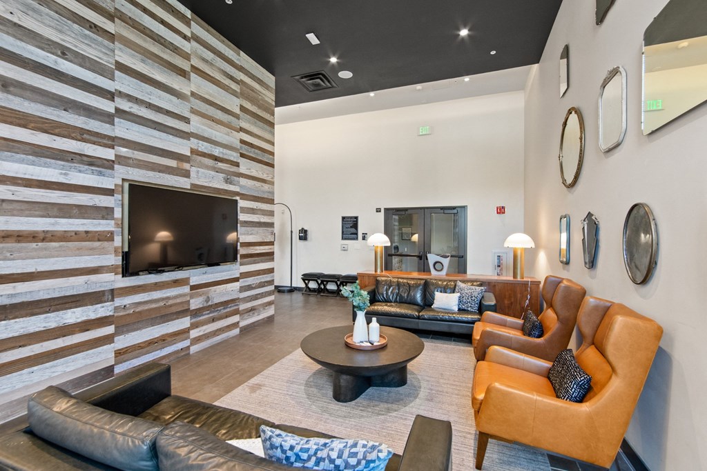 Common Area with Television and Couches at Aventine Apartments in Hercules, CA 94547