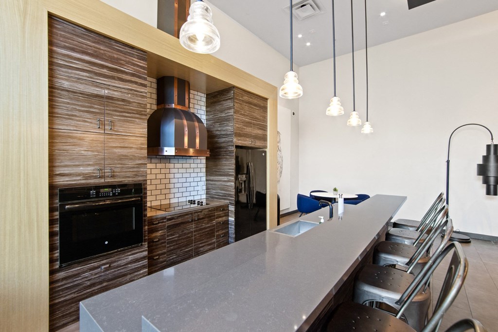 Common Area with Kitchen and Seating at Aventine Apartments in Hercules, CA 94547
