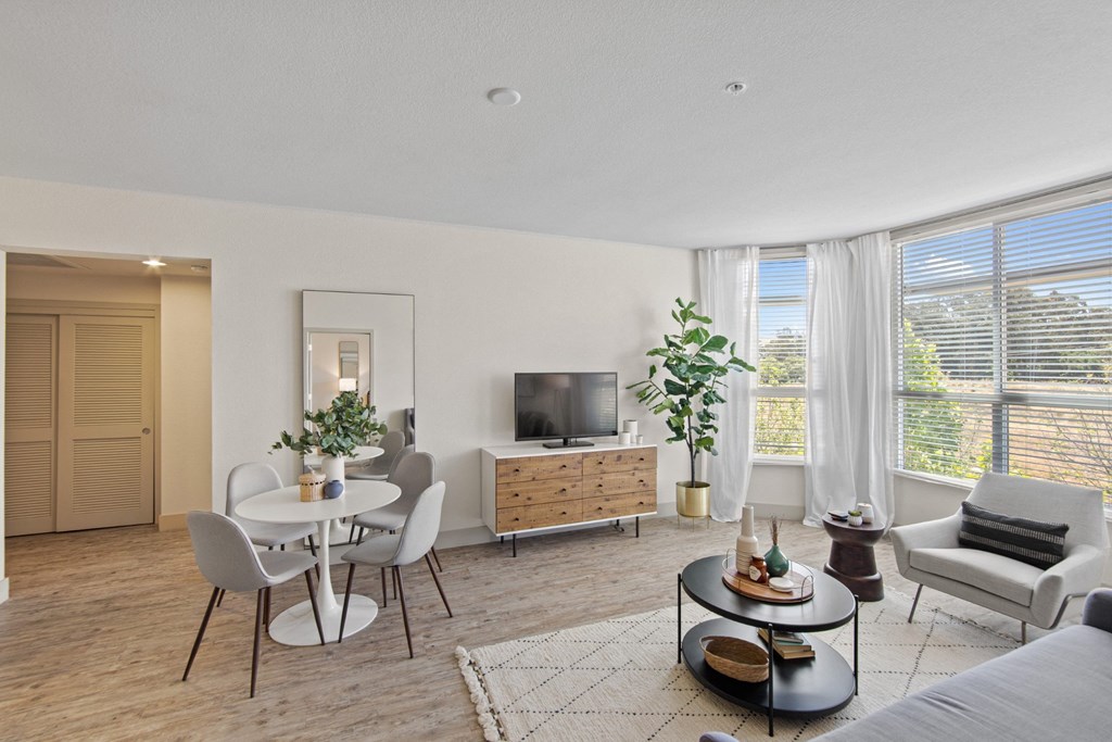 Unit Living Room with Large Windows and Natural Light at Aventine Apartments in Hercules, CA 94547