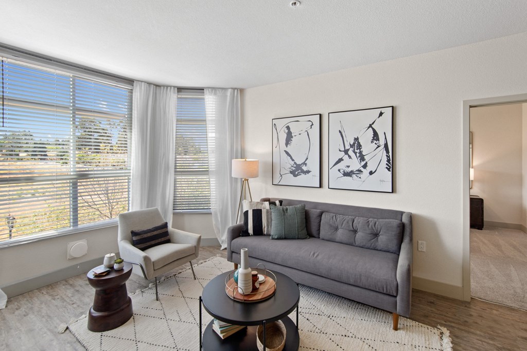 Unit Living Room with Large Windows and Natural Light at Aventine Apartments in Hercules, CA 94547