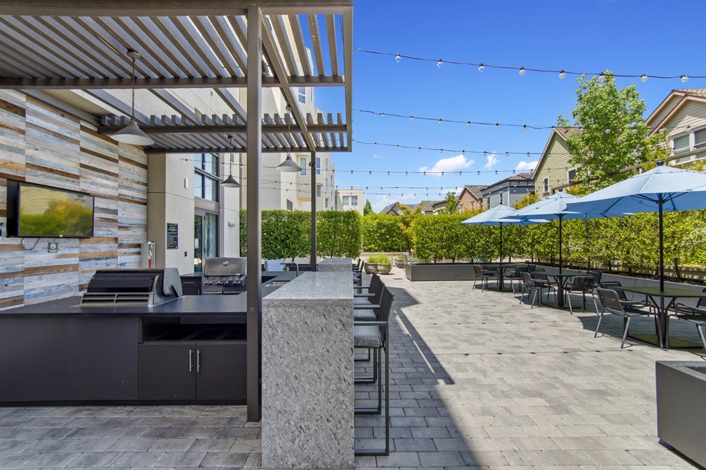 Outdoor Patio with Grill and Seating at Aventine Apartments in Hercules, CA 94547