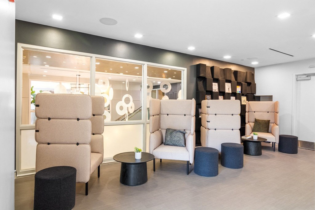 Cozy conversation nooks in the resident lounge at The Amelia Apartments in Quincy, MA