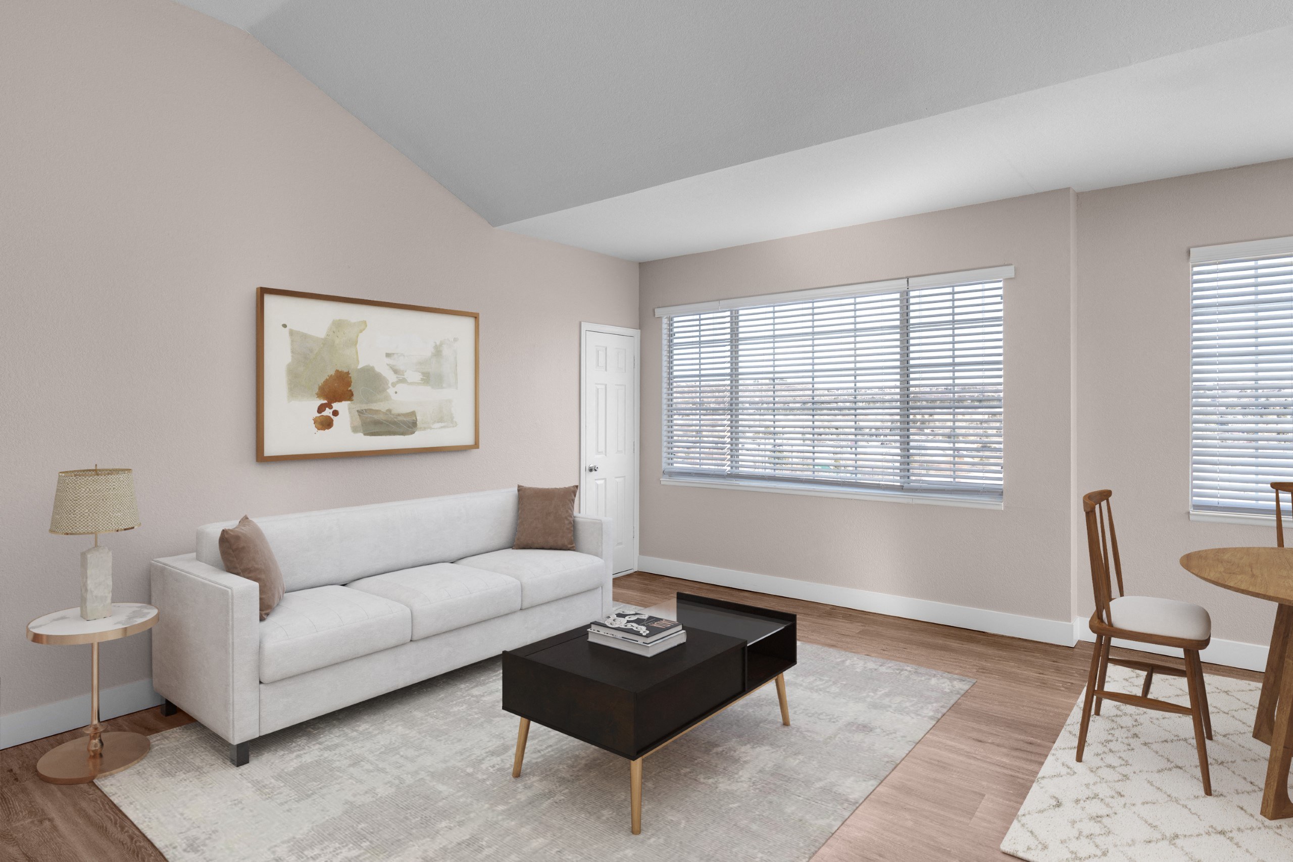 a living room with a white couch and a coffee table