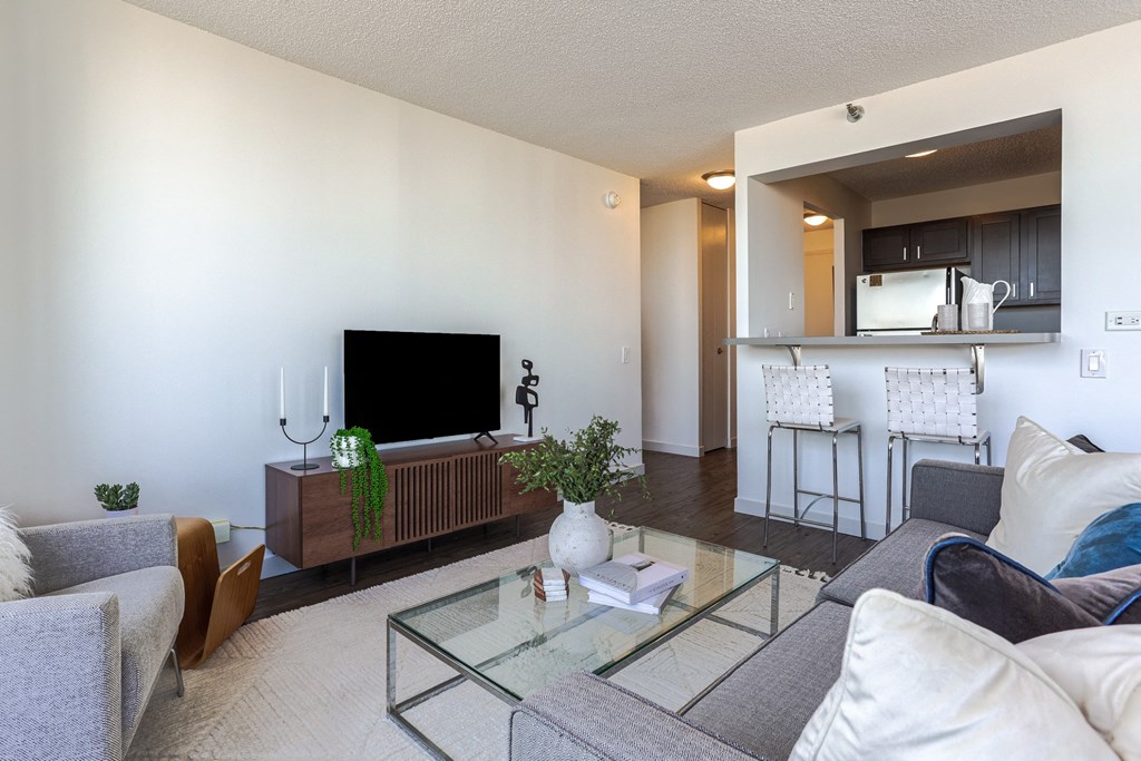 a living room with a couch and a glass table