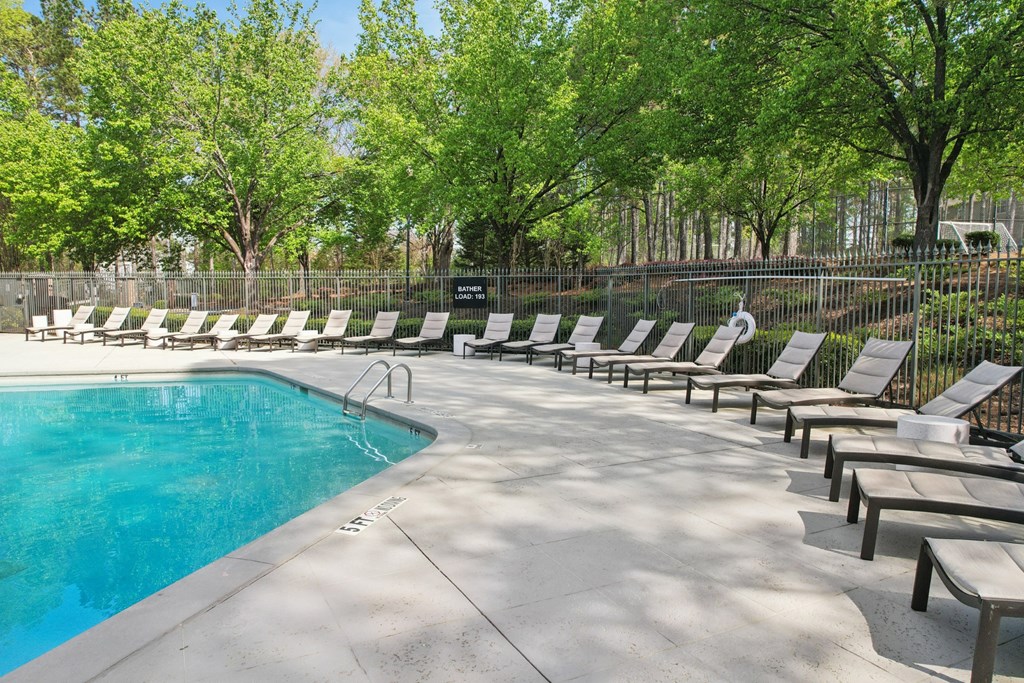 Large Swimming Pool and Chairs at Gwinnett Pointe Apartments in Norcross, GA 30093