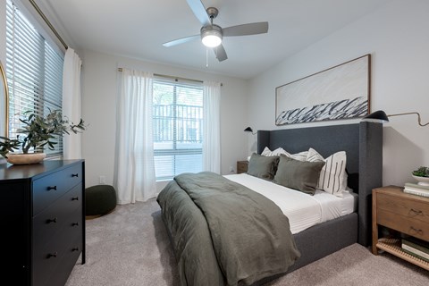 Primary Bedroom at The Kitt at Warner Center Apartments in Woodland Hills, CA 91303