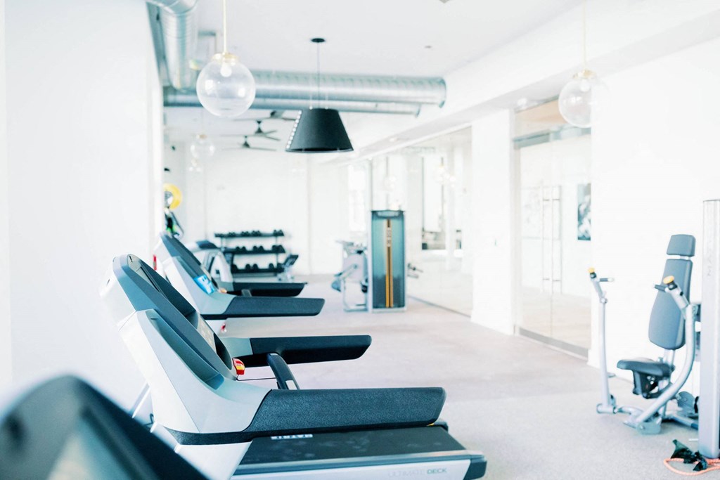 a row of treadmills at the 24-hour fitness center at The Merchant Apartments, Charleston
