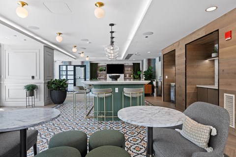 A modern dining area with a round table and chairs.