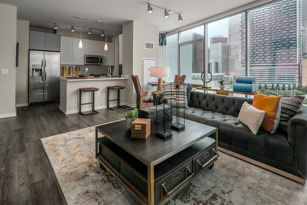 a living room with a couch and a coffee table at The Grand Central, Chicago