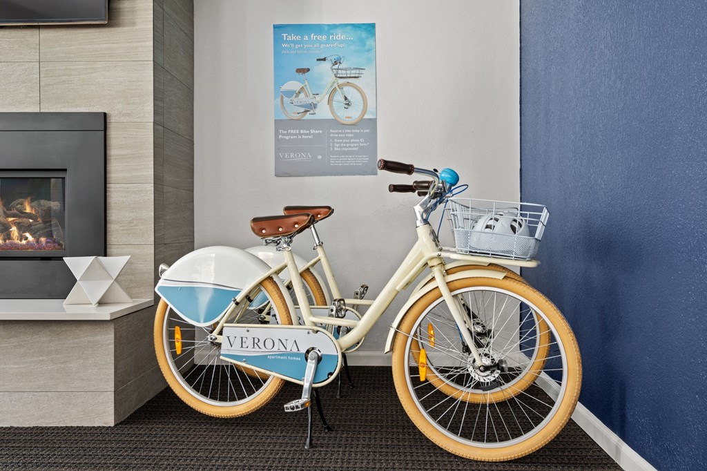 a bike parked next to a wall in a lobby  at Verona, Littleton, CO