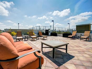 a Sky lounge patio with couches and chairs on top of One Plantation, Plantation Florida
