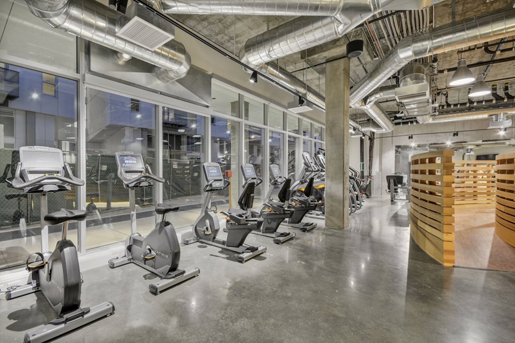 a gym with treadmills and other exercise equipment at L Seven, San Francisco, CA
