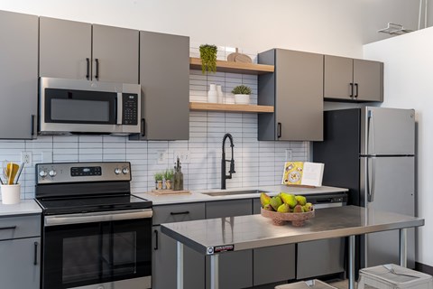 Kitchen with Stainless Steel Appliances  at Highland Mill Lofts in Charlotte, NC
