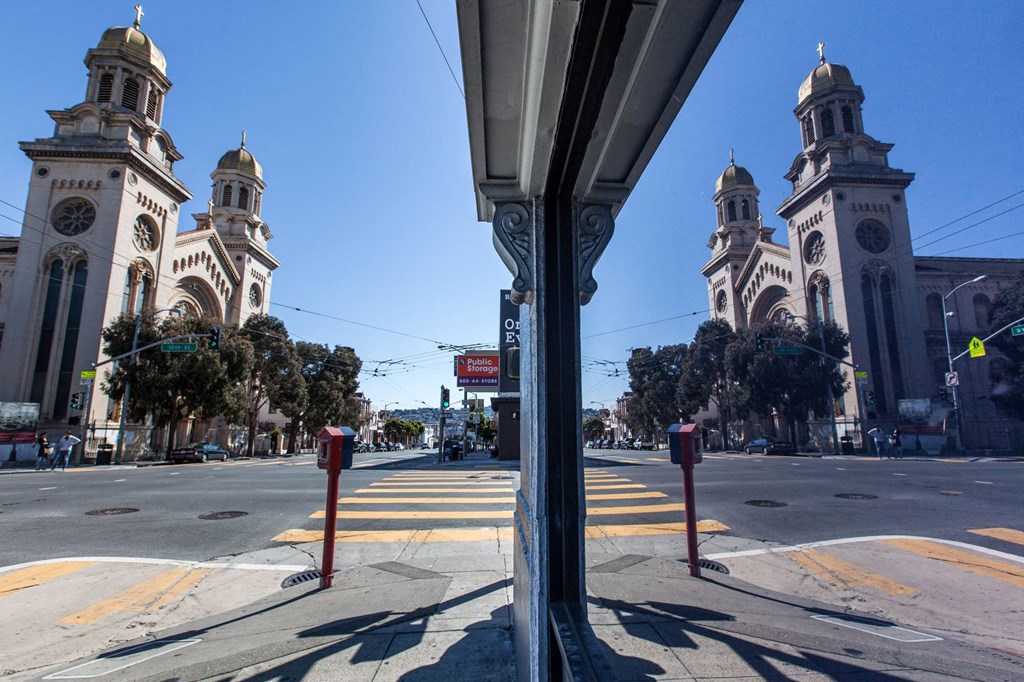 a view of a church from a bus stop on a city street at L Seven, California, 94103