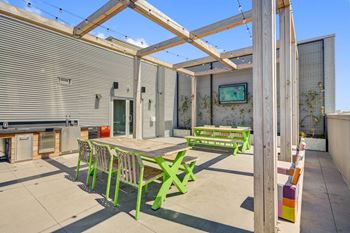 the patio of the house has a table and chairs at L Seven, California