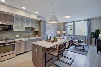 a kitchen and living room with a table and chairs at L Seven, San Francisco