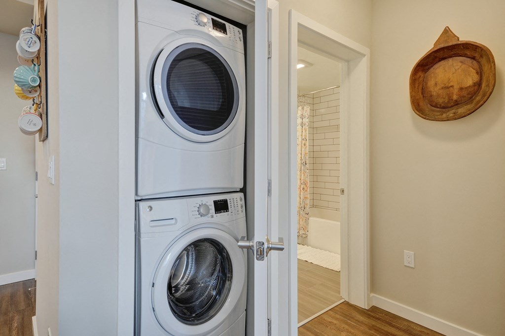 a front loading washer and dryer in a laundry room at L Seven, San Francisco, 94103