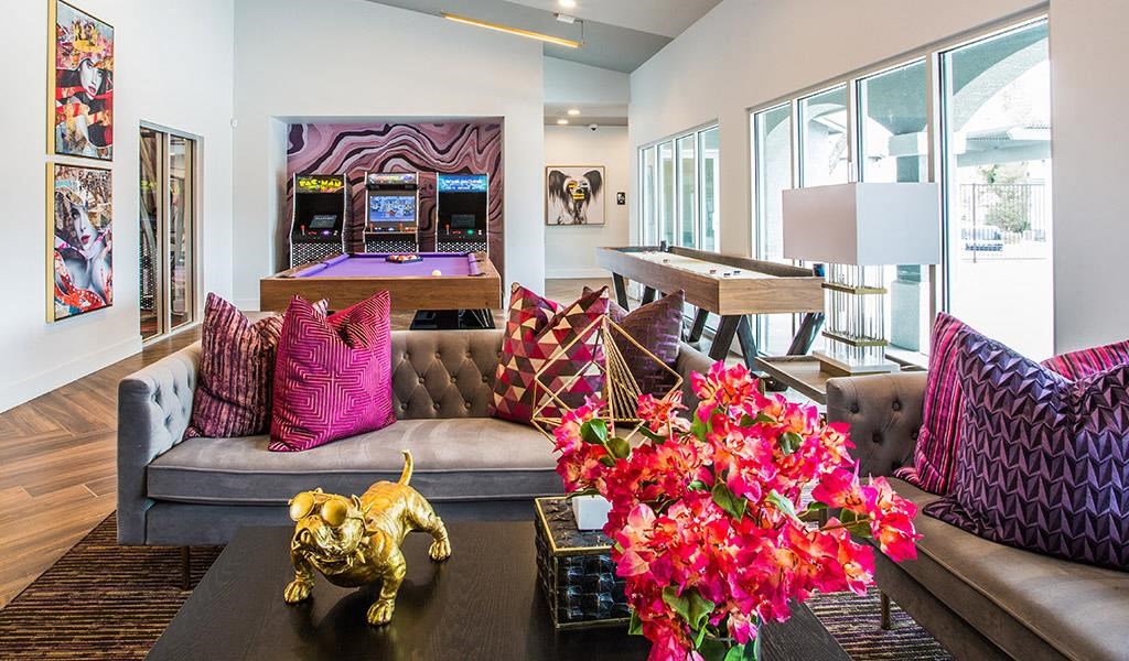 a living room with a couch and a pool table