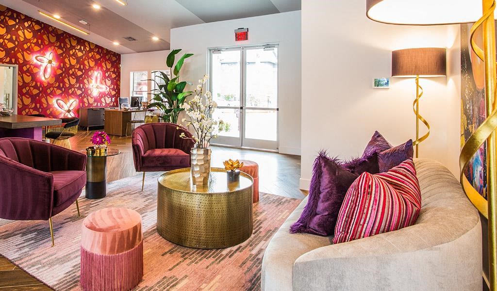 a living room with couches and chairs and a table