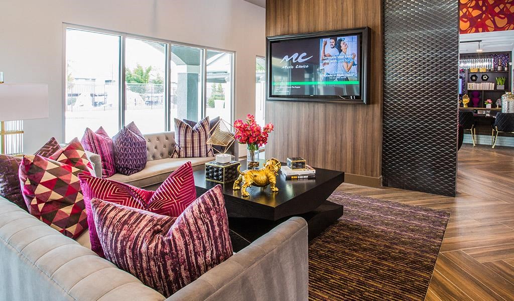 a living room with a couch and a tv