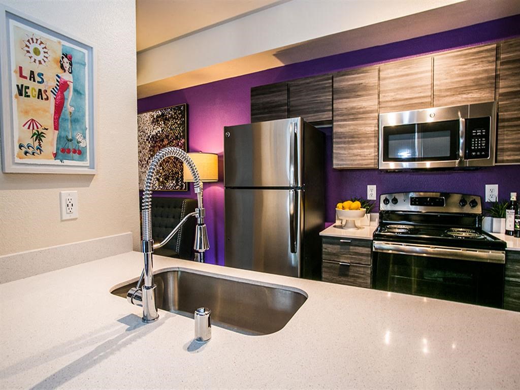 a kitchen with stainless steel appliances and a sink